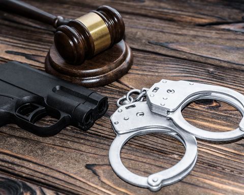 Gun Crime Lawyer — Handcuffs and Gun in Franklin, NC